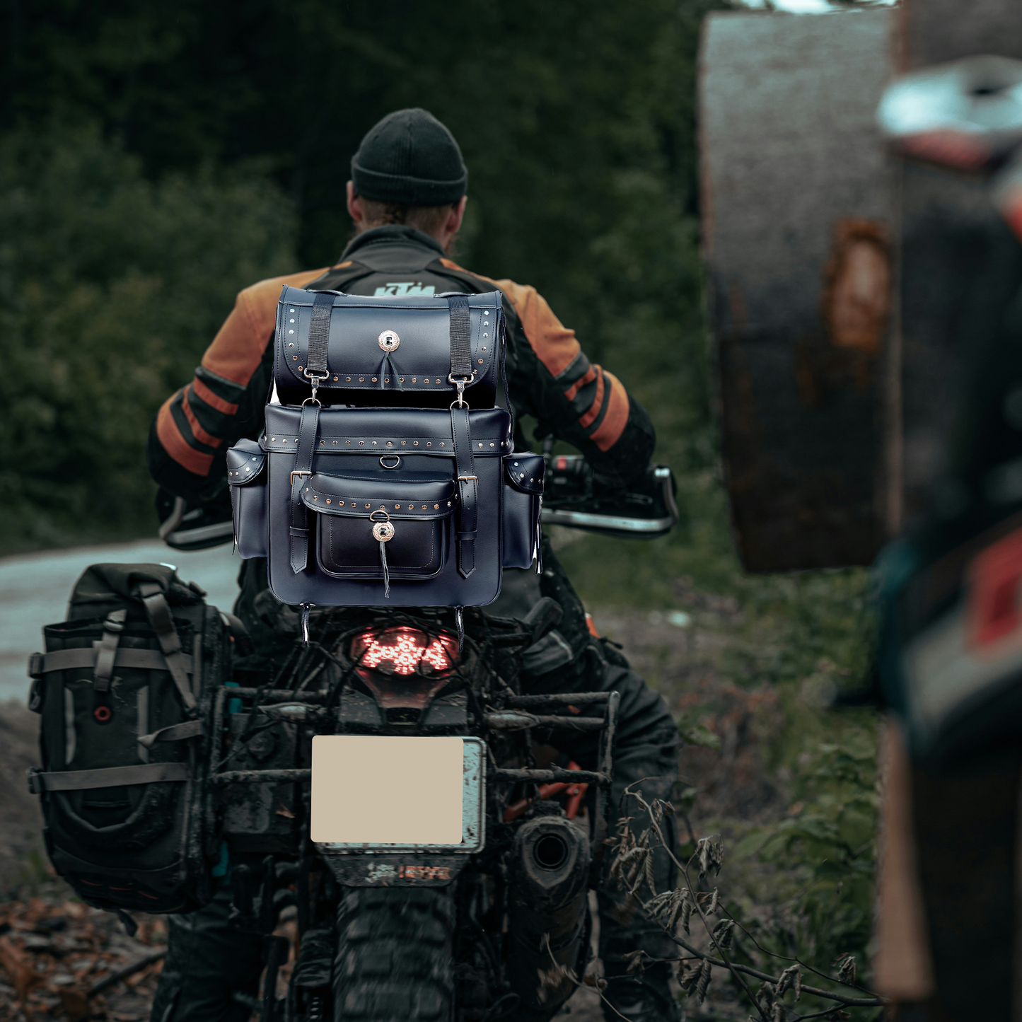 "Motorcycle leather sissy bar touring luggage – black 2-piece studded travel bag with three external pockets for extra storage, water-resistant and durable motorcycle luggage set, secure adjustable mounting system for easy attachment to sissy bars, spacious main compartment for riding gear and accessories, premium leather touring bag with chrome stud accents for Harley, Honda, Yamaha, and more, detachable top bag for versatile packing options, stylish and functional biker luggage for long rides and road tri