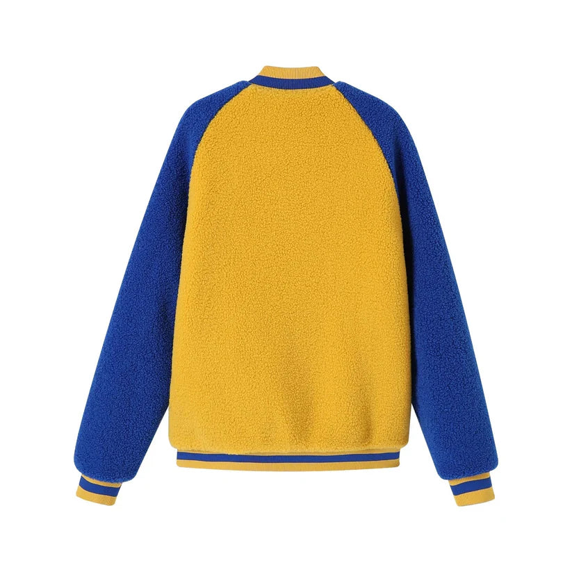 Sigma Gamma Rho (SGRho) Reversible Sherpa Bomber Jacket with one side in blue/gold sherpa and the reverse side in a sleek coordinating material. Highlights the soft, cozy texture and the embroidered appliqué logo.
