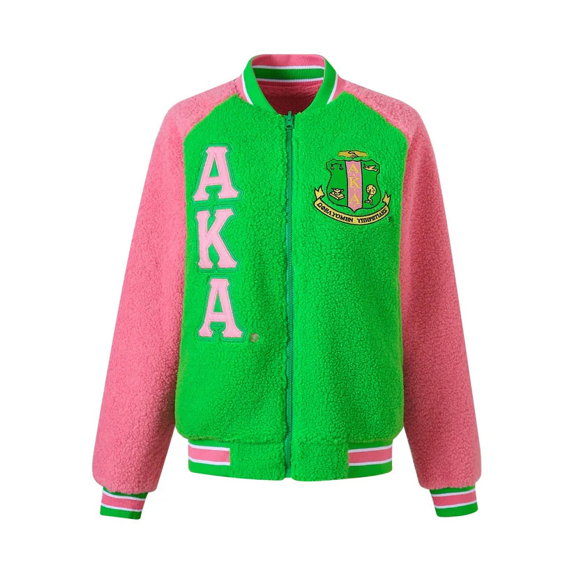 "Unisex Alpha Kappa Alpha (AKA) reversible bomber jacket featuring red and white sherpa material, embroidered appliqué logos, knit ribbing at the neck, cuffs, and waistband, offering cozy warmth and two stylish looks in one."