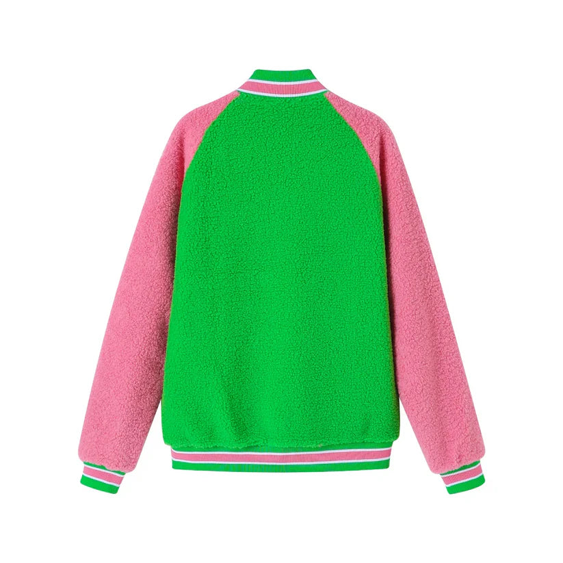 "Unisex Alpha Kappa Alpha (AKA) reversible bomber jacket featuring red and white sherpa material, embroidered appliqué logos, knit ribbing at the neck, cuffs, and waistband, offering cozy warmth and two stylish looks in one."
