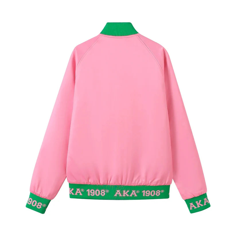 Pink jacket with green accents and 'AKA' branding on a white background