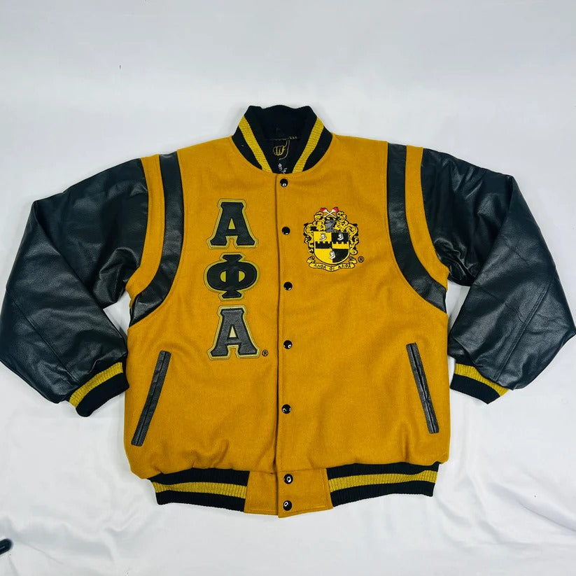 Elevated Alpha Phi Alpha letterman jacket showcasing the contrast between the premium old gold cashmere wool body and black leather sleeves, complete with custom ribbing and satin lining.

