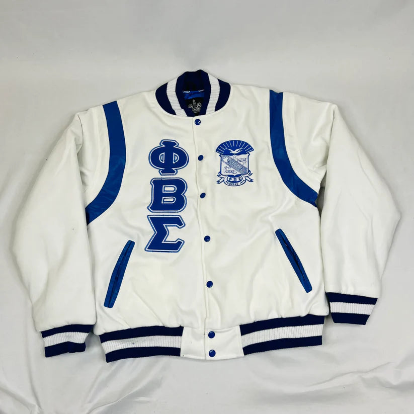 Sigma Letterman Jacket in white 100% cashmere wool with leather trim for men or women. This classic collegiate jacket features embroidered logos and a timeless varsity style.