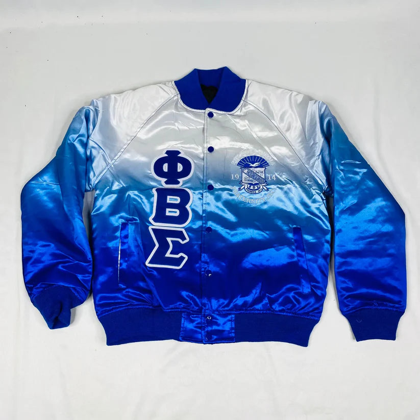 Phi Beta Sigma (PBS) Faded Satin Bomber Jacket for men or women. This unisex jacket features the white-to-royal-blue fade design, premium satin exterior, and a warm quilted interior, perfect for showing fraternity pride.