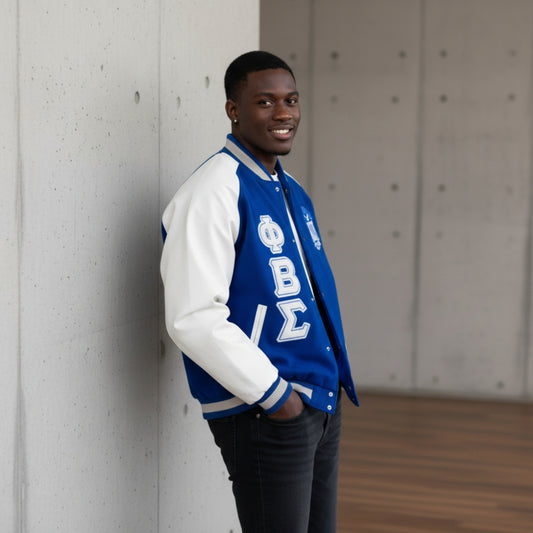 Full-length image of a person wearing the Royal Blue and White Sigma Wool and Leather Letterman Jacket. The jacket features a classic varsity design with a warm wool body, premium leather sleeves, and custom ribbing for a snug, unisex fit.