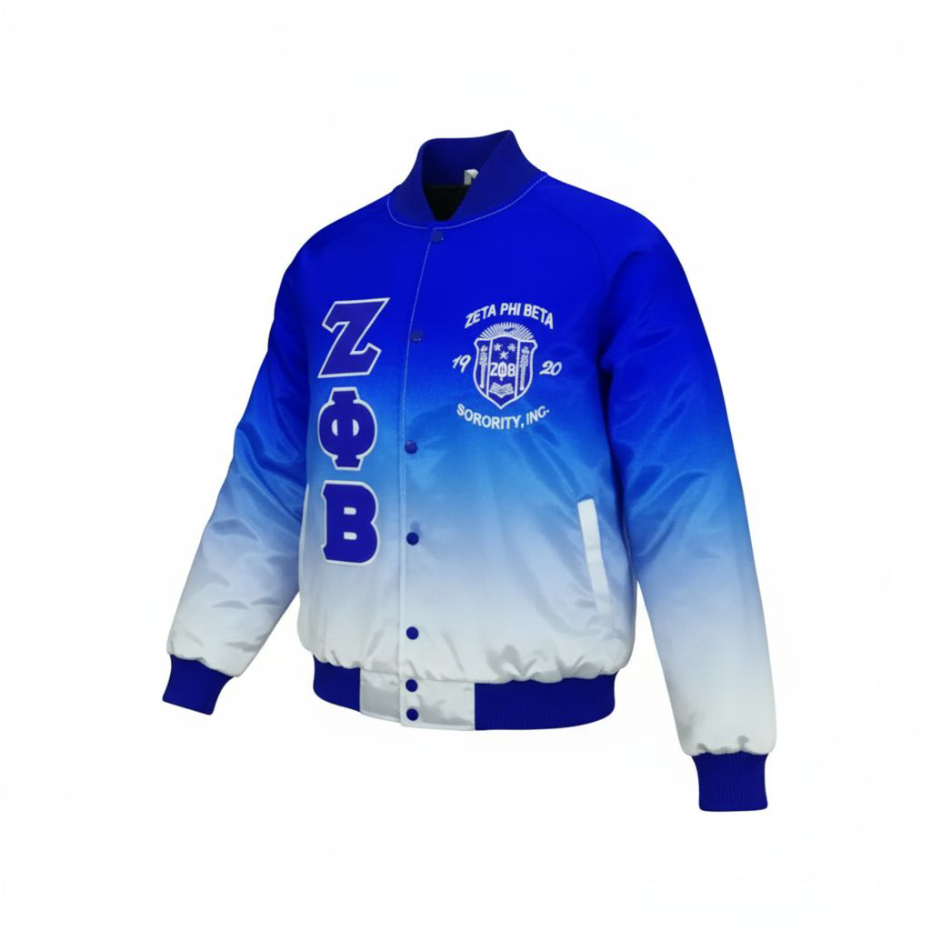 The Zeta Phi Beta Faded Bomber Jacket showcasing the smooth satin material and the unique Royal Blue fade to White color design. Highlights the embroidered ZPB logo on the front and the custom embroidery on the back.