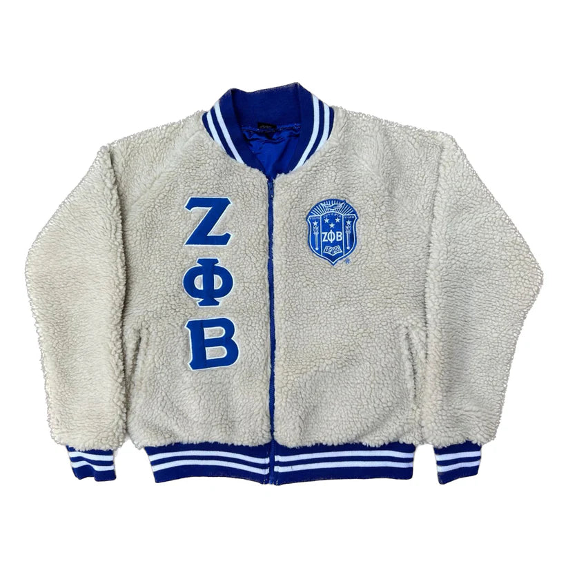 Gray fleece jacket with blue accents and 'Z Phi B' letters on a white background