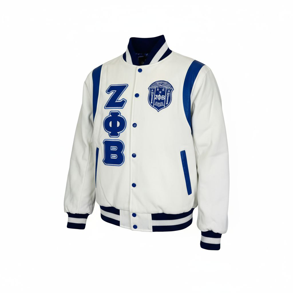 A close-up of the Zeta Letterman Jacket showing the luxurious white 100% cashmere wool body contrasting with the smooth royal blue 100% leather shoulders. Highlights the embroidered Zeta logo and custom ribbing.