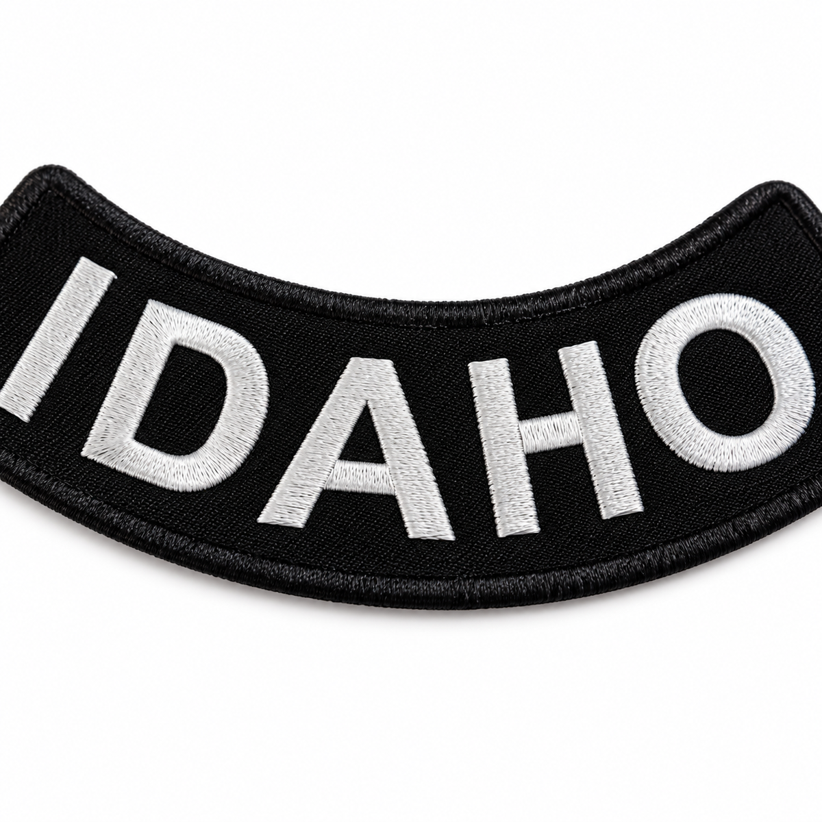Idaho white on black embroidered bottom rocker patch — close-up of embroidery stitching