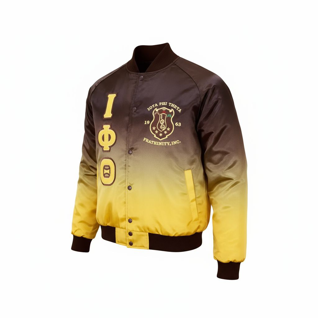 The Iota Phi Theta Faded Bomber Jacket showcasing the smooth satin material and the unique brown fade to yellow gold ombré design. Highlights the embroidered Iota Phi Theta (IOT) logo and brown knit ribbing.