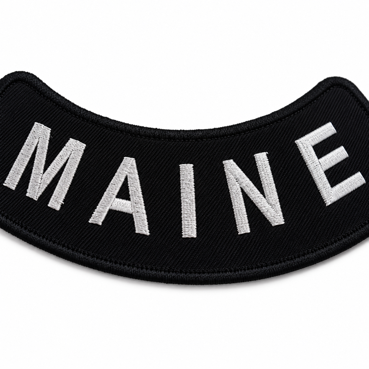 Maine white on black embroidered bottom rocker patch — close-up of embroidery stitching