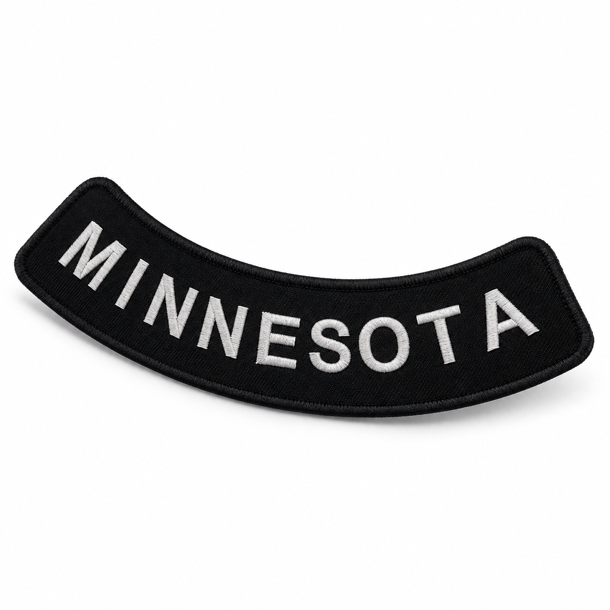 Minnesota white on black embroidered bottom rocker patch — angled view showing curved shape