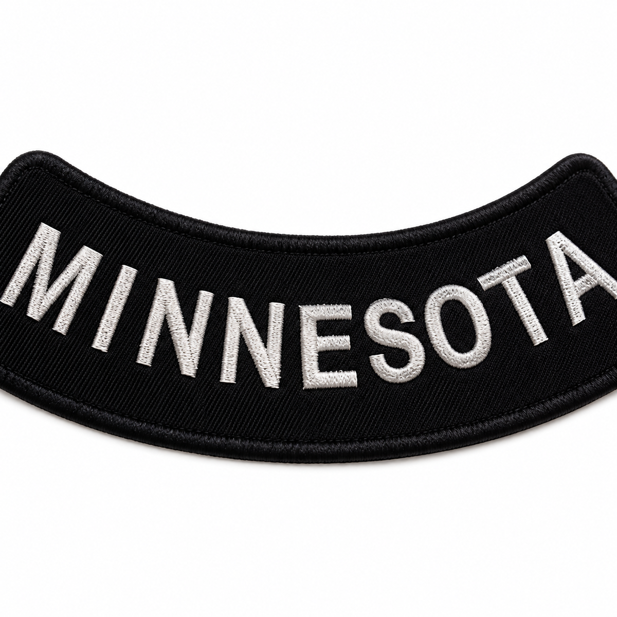 Minnesota white on black embroidered bottom rocker patch — close-up of embroidery stitching