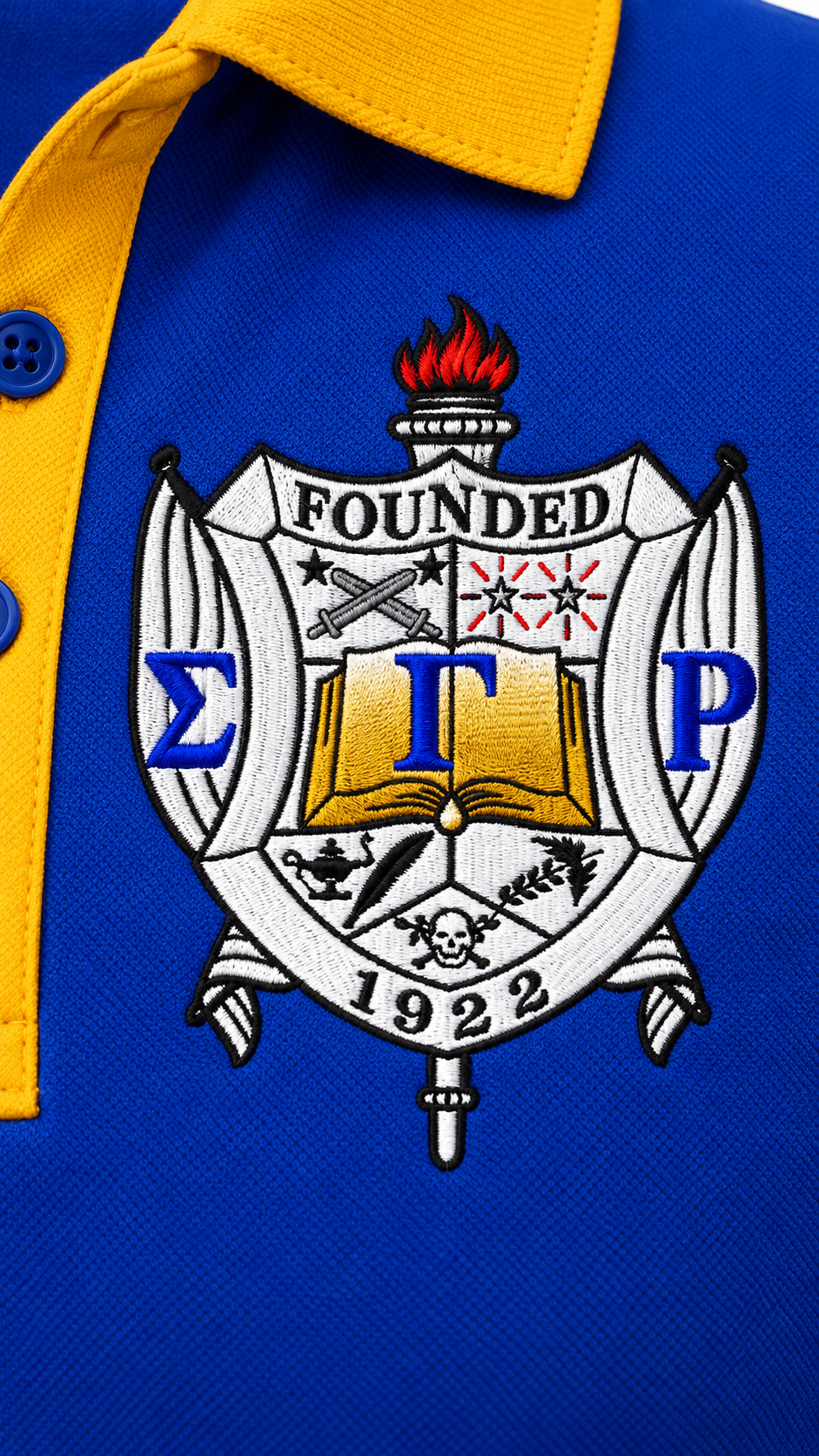 Close-up of detailed Sigma Gamma Rho embroidered chest crest on royal blue performance polo fabric