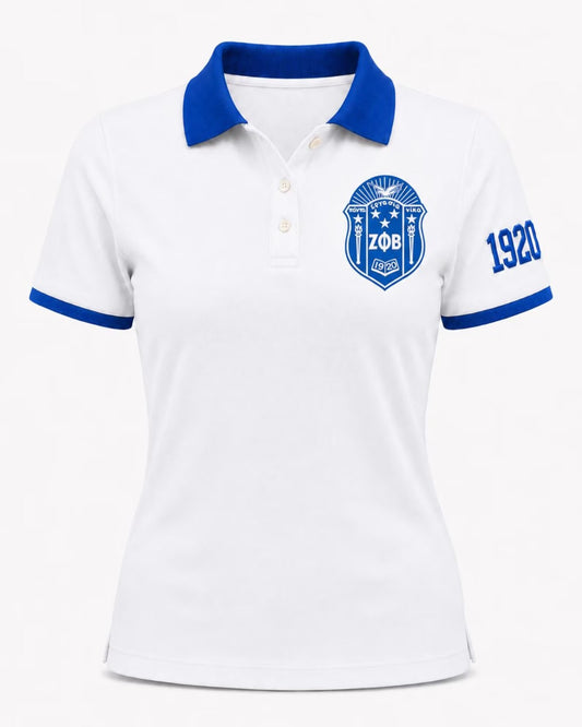 White short-sleeve polo shirt with a blue collar, blue sleeve trim, a blue crest on the left chest, and the number 1920 on the right sleeve, shown on a plain light background.